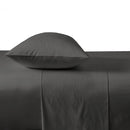 alt="Charcoal plain fitted sheet in comfy bedroom"