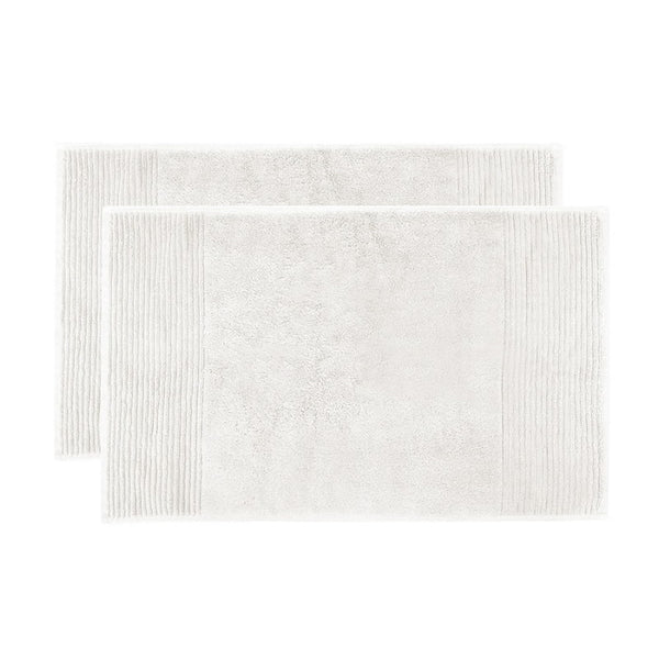 alt="Two beautiful, soft ivory cotton bath mats"