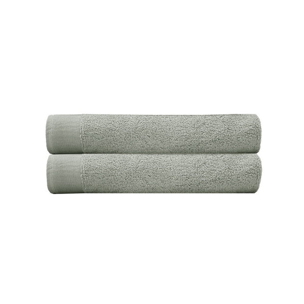 alt="Two beautiful, soft sage green cotton bath towels"