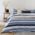 alt="Featuring blue horizontal stripes quilt cover set in comfortable bedroom"