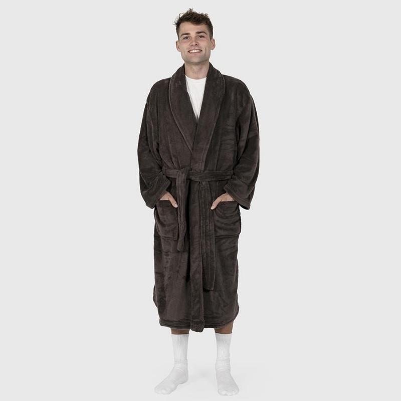 alt="A man standing wearing a microplush brown robe"