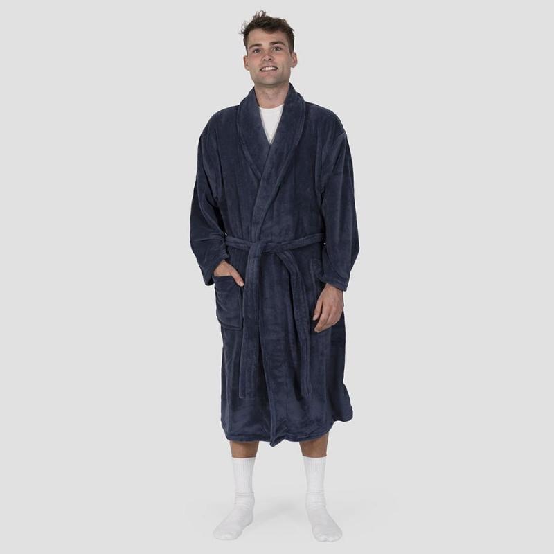 alt="A man standing wearing a microplush denim blue robe"