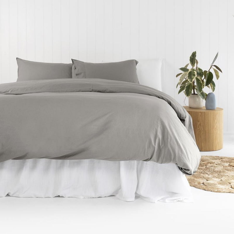 alt="Grey plain organic cotton quilt cover set in a minimalist style bedroom"