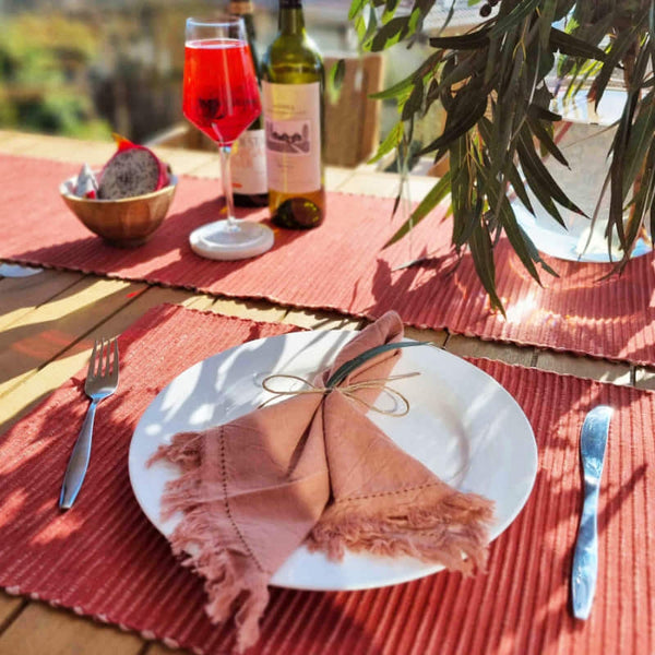 alt="Set of rust placemats featuring a two-toned ribbed design"