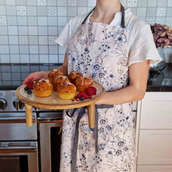 alt="Cream apron inspired by the blooming and blossoming of wild field flowers"