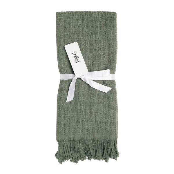 alt=" A 100% cotton, waffle weave front, terry fabric underside, and decorative fringe accents hand towels"