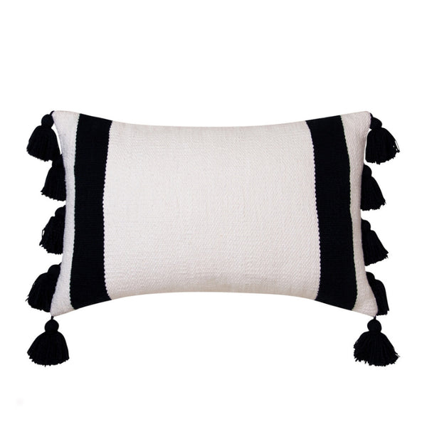alt="Front details of an ivory cushion featuring a block-coloured design with two thick solid black stripes and with two sides of chunky tassels"