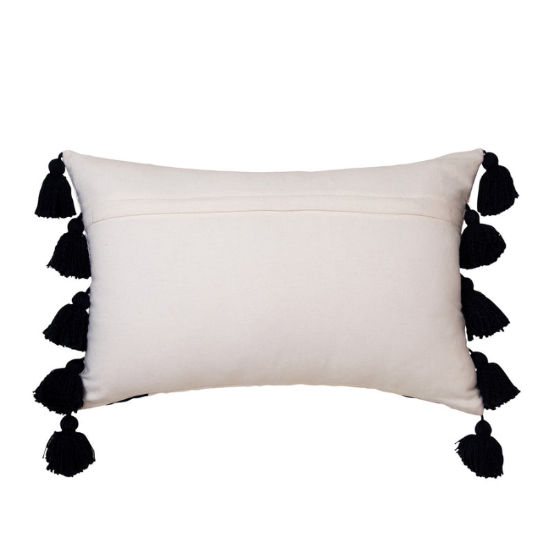 alt="Back details of an ivory cushion featuring a block-coloured design with two thick solid black stripes and with two sides of chunky tassels"