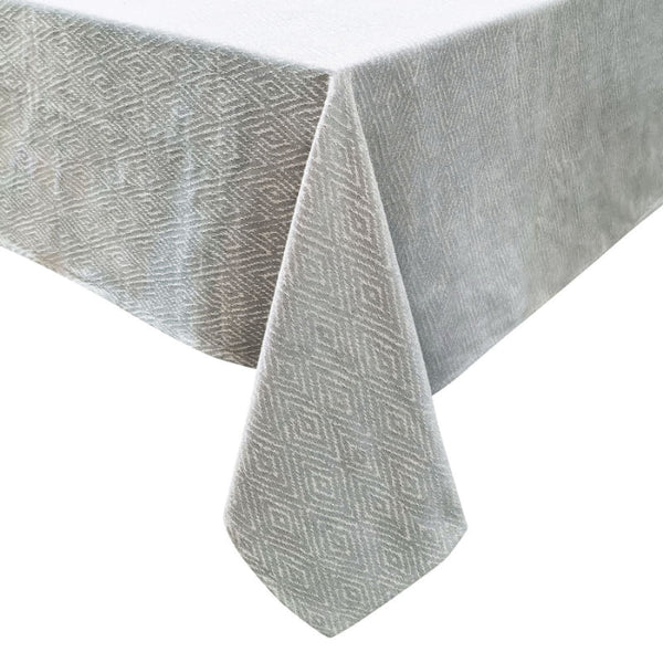 alt="A grey and white tablecloth features a gorgeous diamond-patterned design"