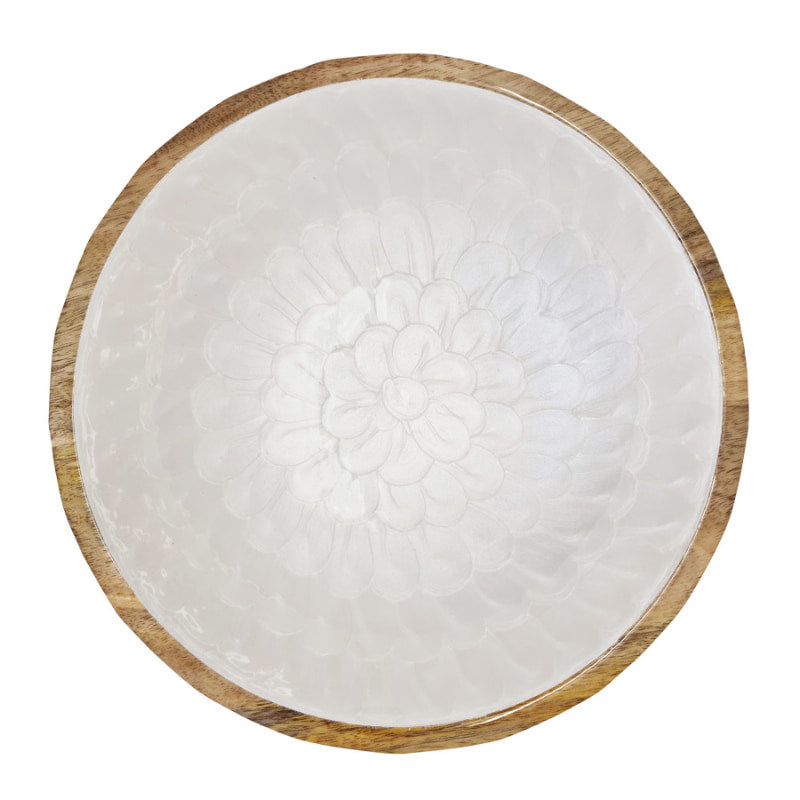 alt="Front details of a salad bowl featuring a stunning embossed pearl design coated in enamel with a carved mango wood base." 