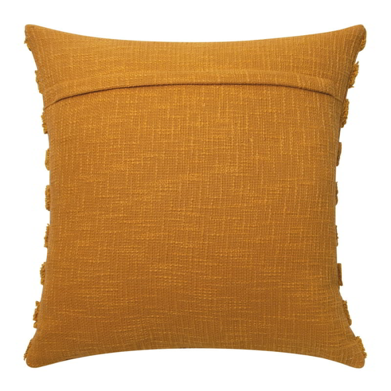 alt="Back details of a stunning mustard cushion with striped tufted design over a heavily textured slab base"