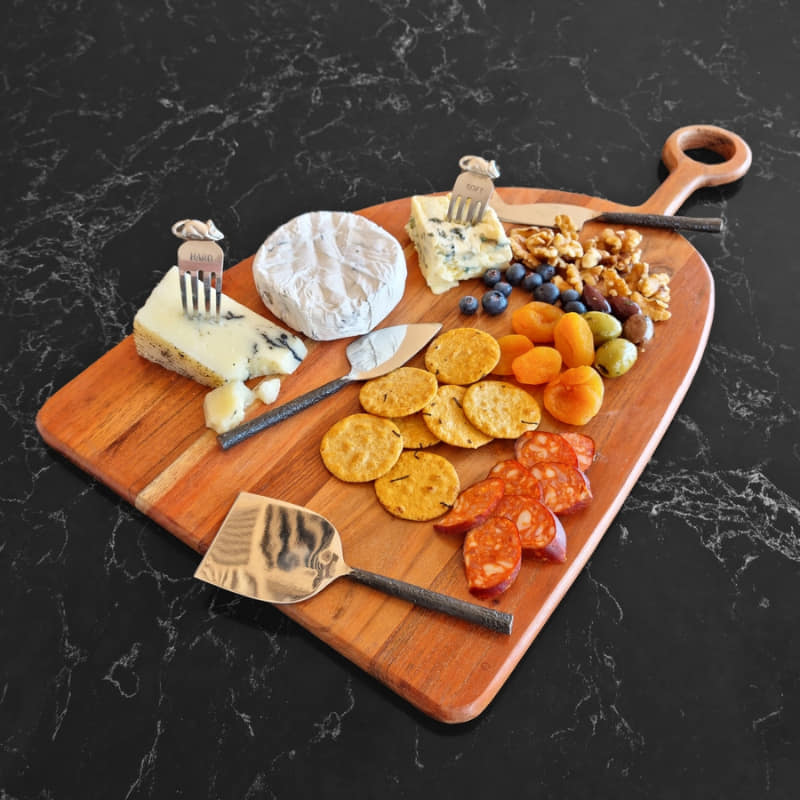alt="A chopping board handcrafted with acacia wood is designed to last."