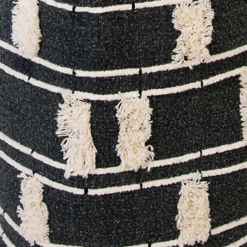 alt="Close-up look of a stylish, black and white, eco-friendly, and durable cotton basket with a modern chic design for a clutter-free and organised home."