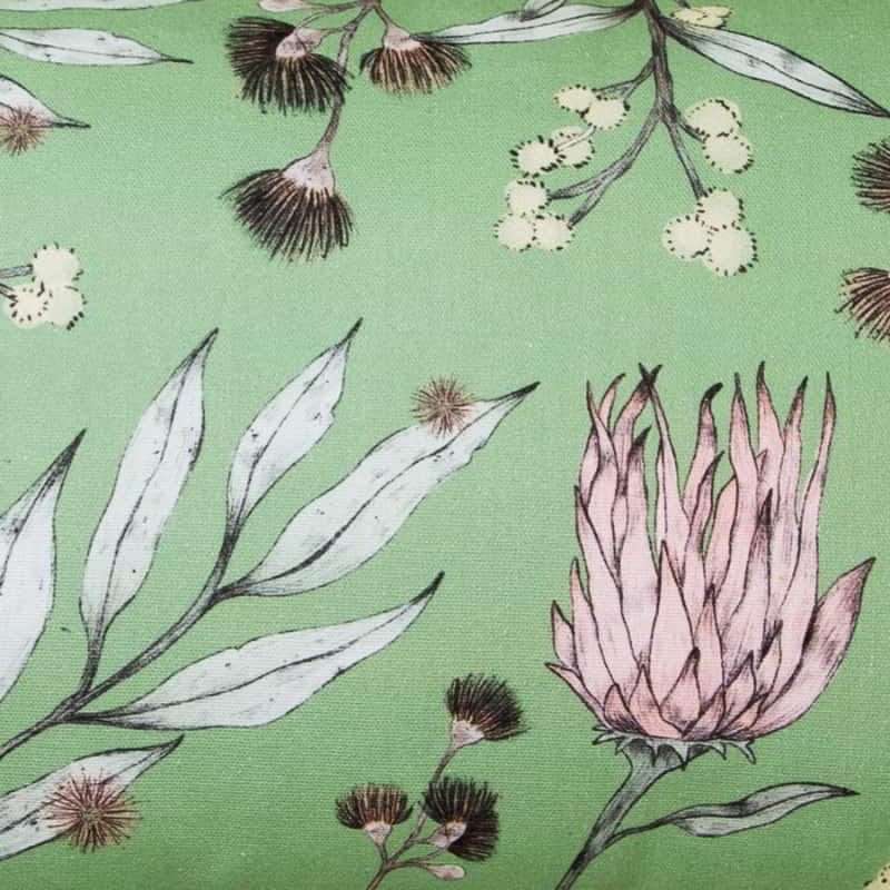 alt="Close-up details of a green multicoloured cushion inspired by Australian flora and fauna."