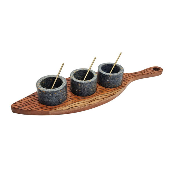alt="A serving board with condiment bowls and spoons features three handcrafted detachable terrazzo bowls nestled into a beautifully carved acacia wood tray, each with its own golden spoon."