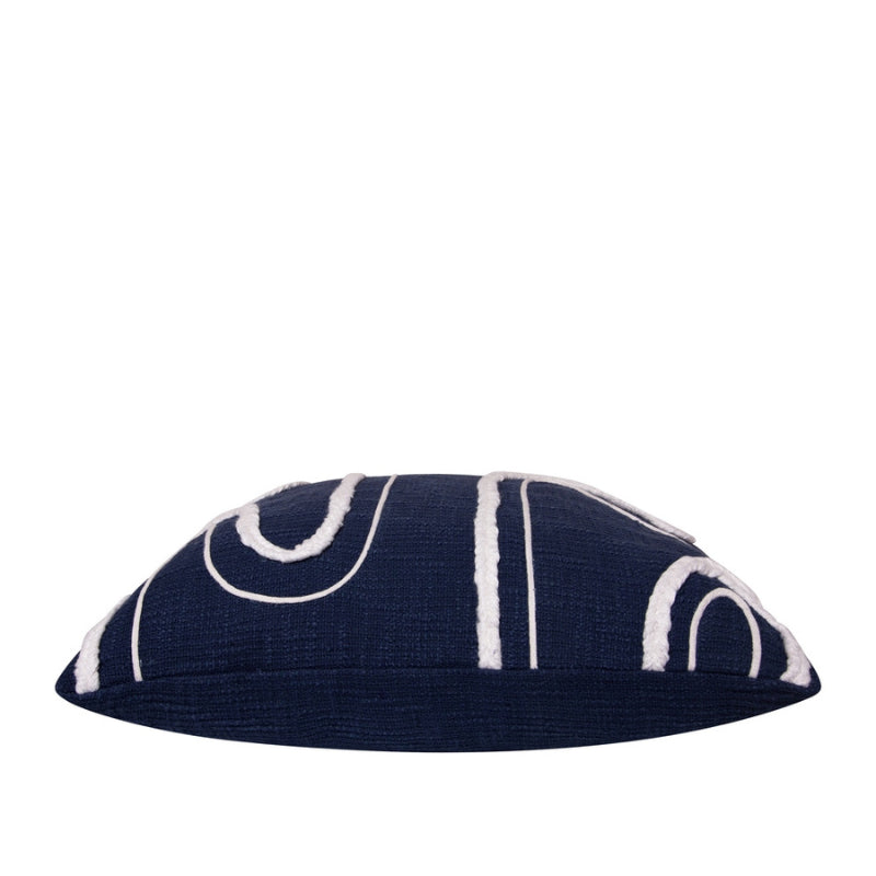 alt="Side details of a navy blue cushion featuring a curved white cotton braids."