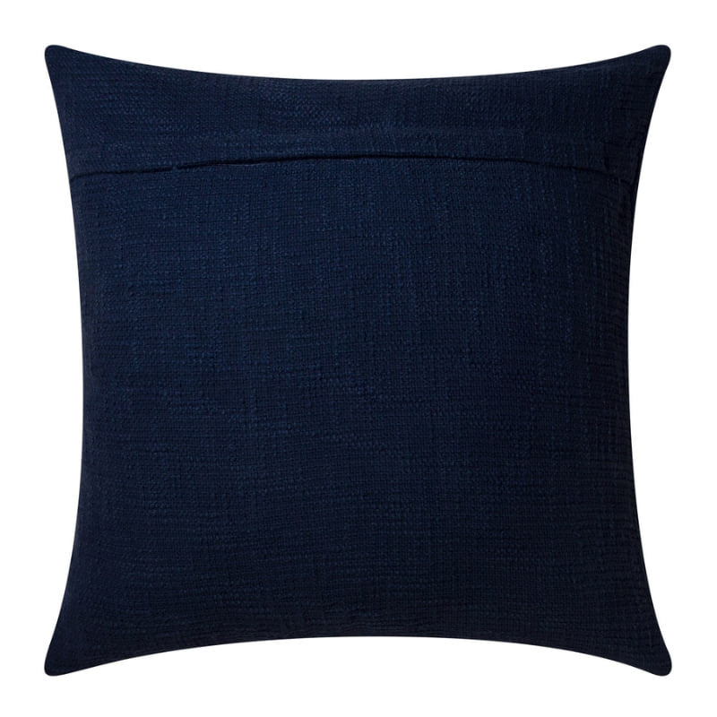 alt="Plain back details of a navy blue cushion featuring a curved white cotton braids."