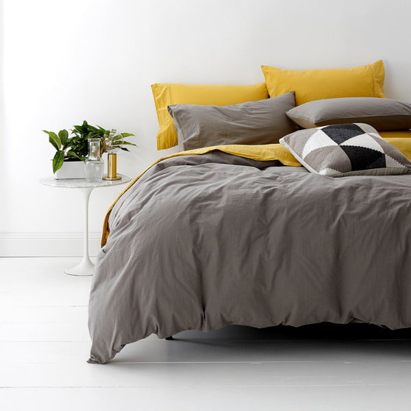 alt="A shade of grey quilt cover is soft, stylish percale bedding set made of fine cotton percale. Timeless design for modern bedrooms."