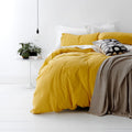alt="A shade of yellow quilt cover is soft, stylish percale bedding set made of fine cotton percale. Timeless design for modern bedrooms."