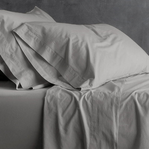 alt="A grey plain sheet set featuring an ultra-soft, velvety texture in a luxurious bedroom"