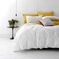 alt="Vintage washed white quilt cover set with rich garment-dyed yellow colour. Ultra-soft feel, premium cotton percale."