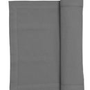 A grey runner elegantly folded, enhancing the sophistication of the dining experience.