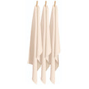 A trio of natural tea towels displayed on clothes pegs, emphasizing their absorbency and stylish appearance for kitchen tasks.