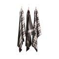 Three grey tea towels hanging on clotheslines, showcasing elegant designs and absorbent cotton for kitchen utility.