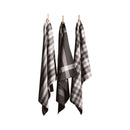 Three grey tea towels hanging on clotheslines, showcasing elegant designs and absorbent cotton for kitchen utility.