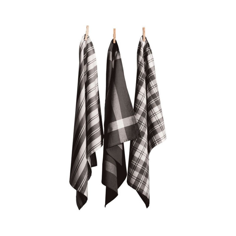 Three grey tea towels hanging on clotheslines, showcasing elegant designs and absorbent cotton for kitchen utility.