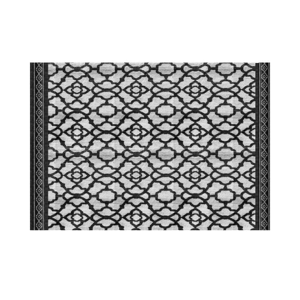 A stylish black placemat featuring a geometric design, perfect for elevating dining experiences.