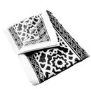 A neatly folded black tablecloth, showcasing its smooth texture and elegant style.