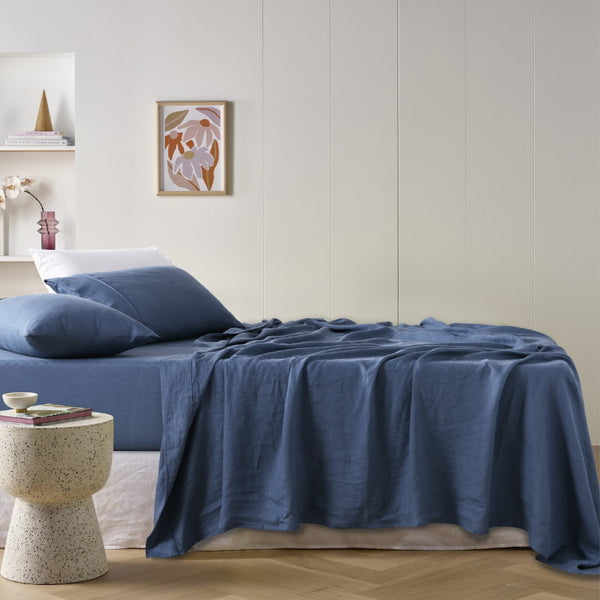 alt="A blue sheet set is lightweight, breathable and keeps cosy in winter"