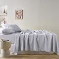 alt="A grey sheet set is lightweight, breathable and keeps cosy in winter"