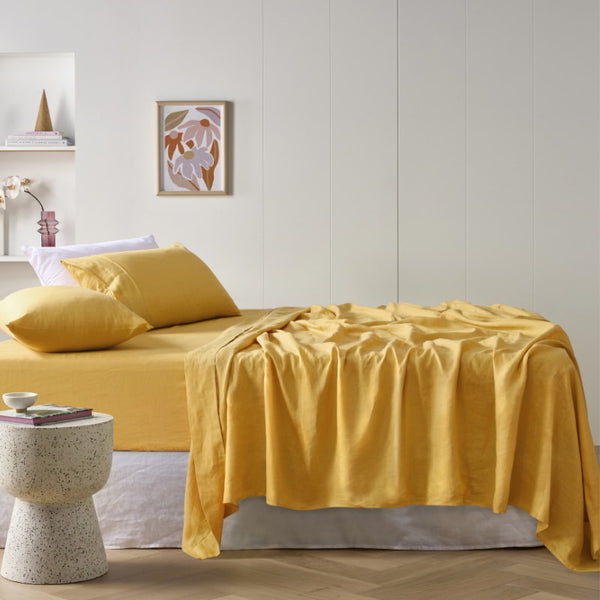 alt="A yellow sheet set is lightweight, breathable and keeps cosy in winter"
