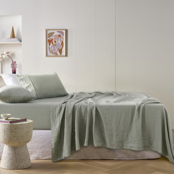 alt="A green sheet set is lightweight, breathable and keeps cosy in winter"