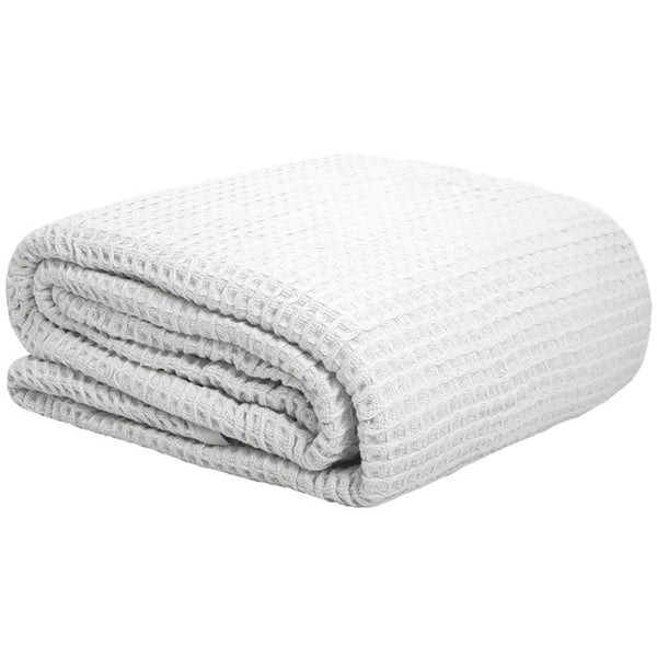 alt="Classic waffle weave pattern white cotton blanket"