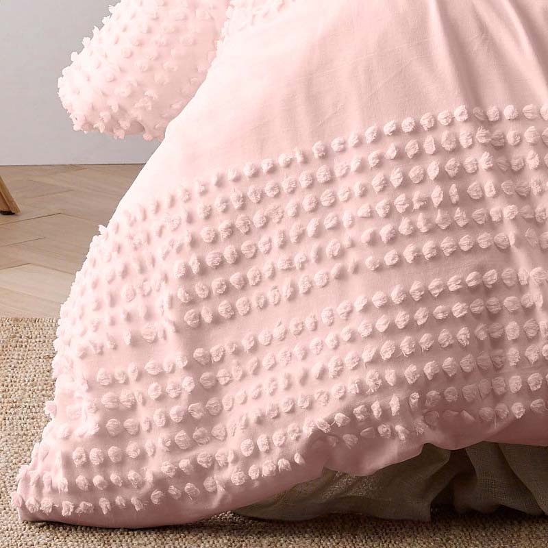 alt="Close up look of a textured cotton quilt cover set with chenille dot pattern for added style and comfort."