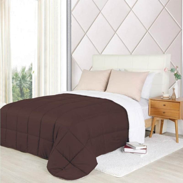 Elegant brown comforter on a bed; the reversible design provides warmth and style, making it ideal for chilly nights.