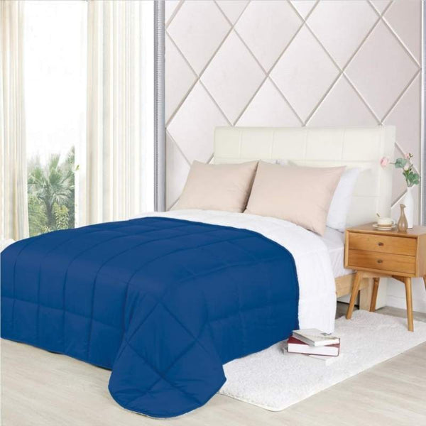 A luxurious navy blue comforter which is perfect for a cosy and stylish bedroom.