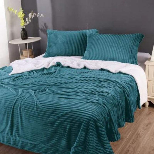 An exquisite 3D stripe design and plush microfibre polyester are features of this teal stripe flannel sherpa comforter set.
