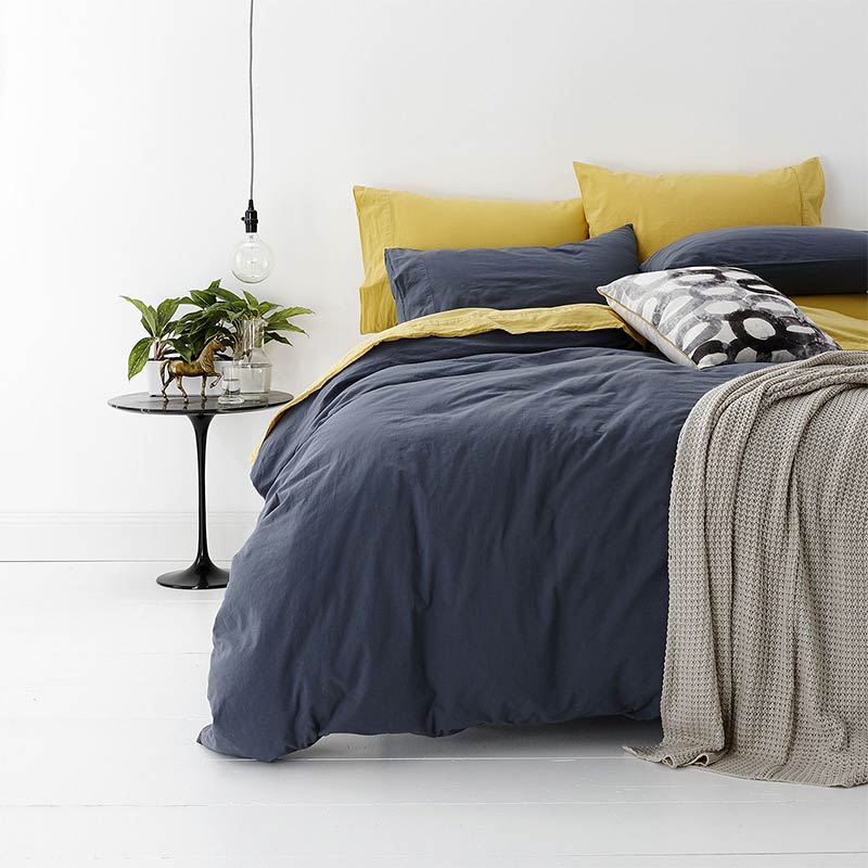 alt="A shade of blue quilt cover is soft, stylish percale bedding set made of fine cotton percale. Timeless design for modern bedrooms."
