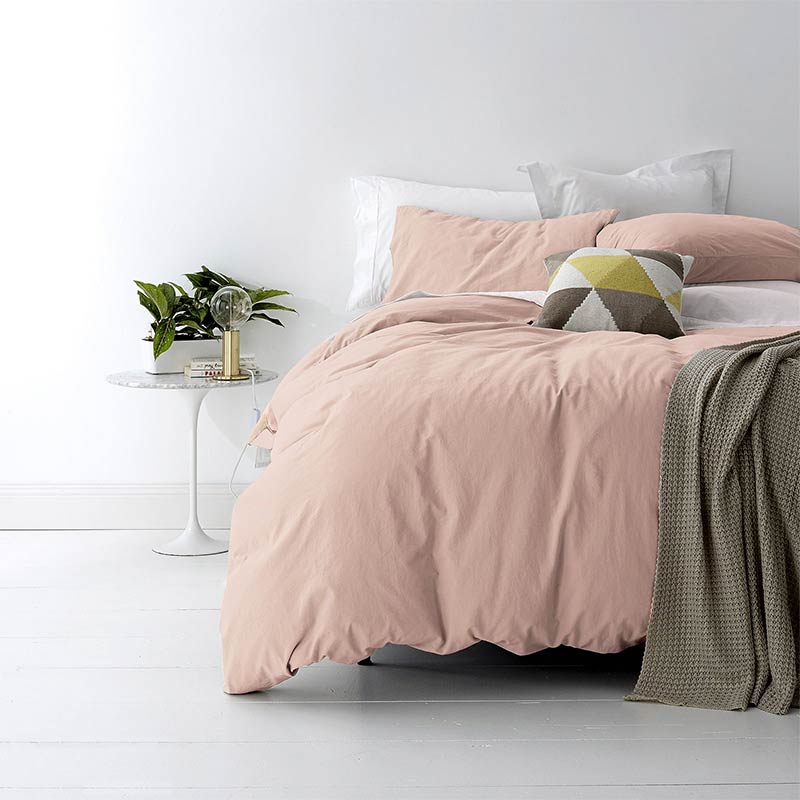 alt="A shade of pink quilt cover is soft, stylish percale bedding set made of fine cotton percale. Timeless design for modern bedrooms."